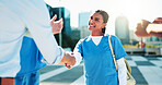Medical students, happy people and handshake for support, agreement or residency completion. Healthcare nurse, outdoor and girl with lecturer for praise, congratulations or education goal in city