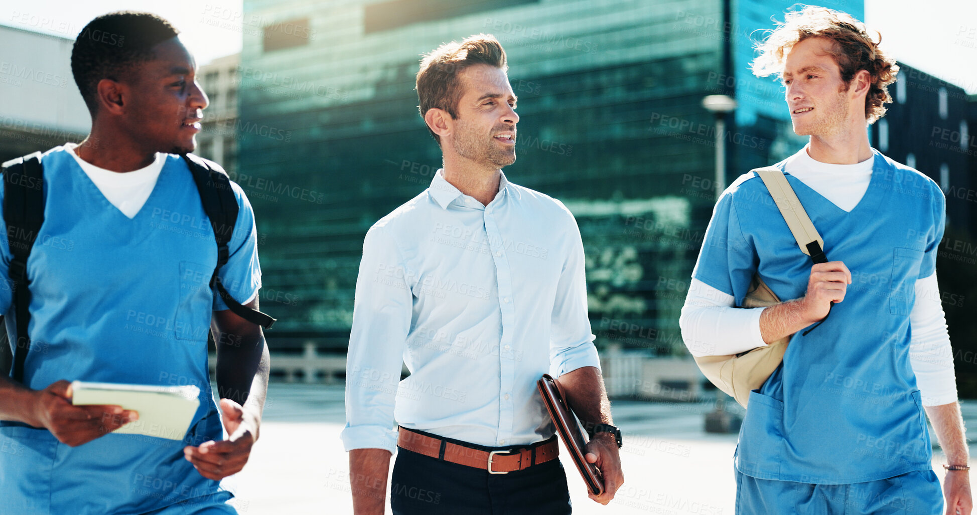 Buy stock photo Professor, medical and men students walking for studying, nursing program and healthcare opportunity. People, teacher and travel for morning commute, learning internship and university course in city