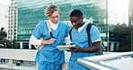 Medical, students and men on tablet outdoor for education, help and discussion. Digital technology, city and healthcare nurses reading schedule, exam results and team learning for college on rooftop