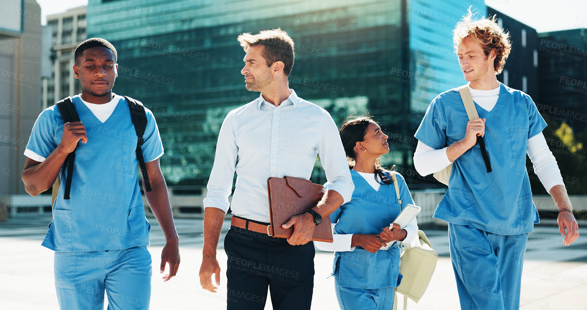 Buy stock photo Professor, nurse and group of students walking for medical study, program and healthcare opportunity. People, teacher and travel for morning commute, learning internship and university course in city