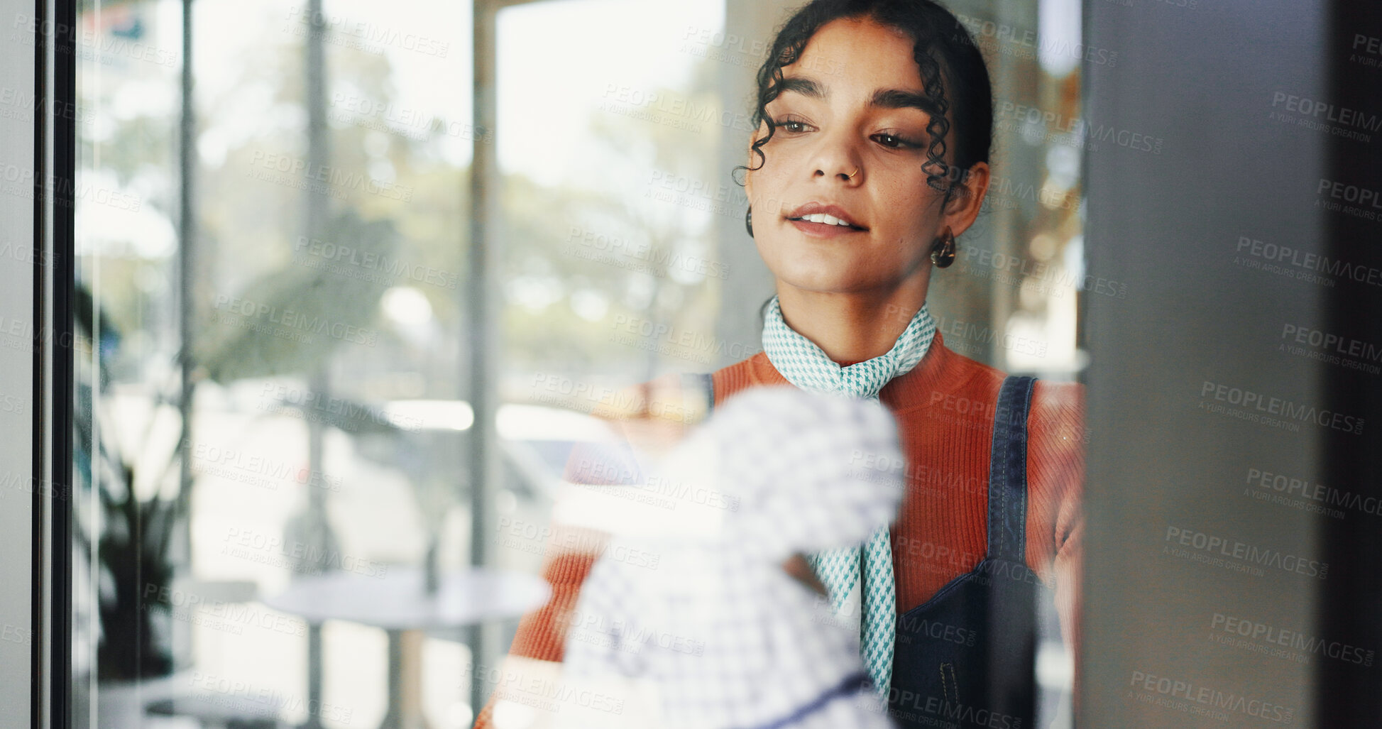 Buy stock photo Cleaning, small business and woman in cafe, window and hygiene with cloth in store, waitress and bacteria. Maintenance, entrepreneur and disinfection of coffee shop, wiping and person in startup