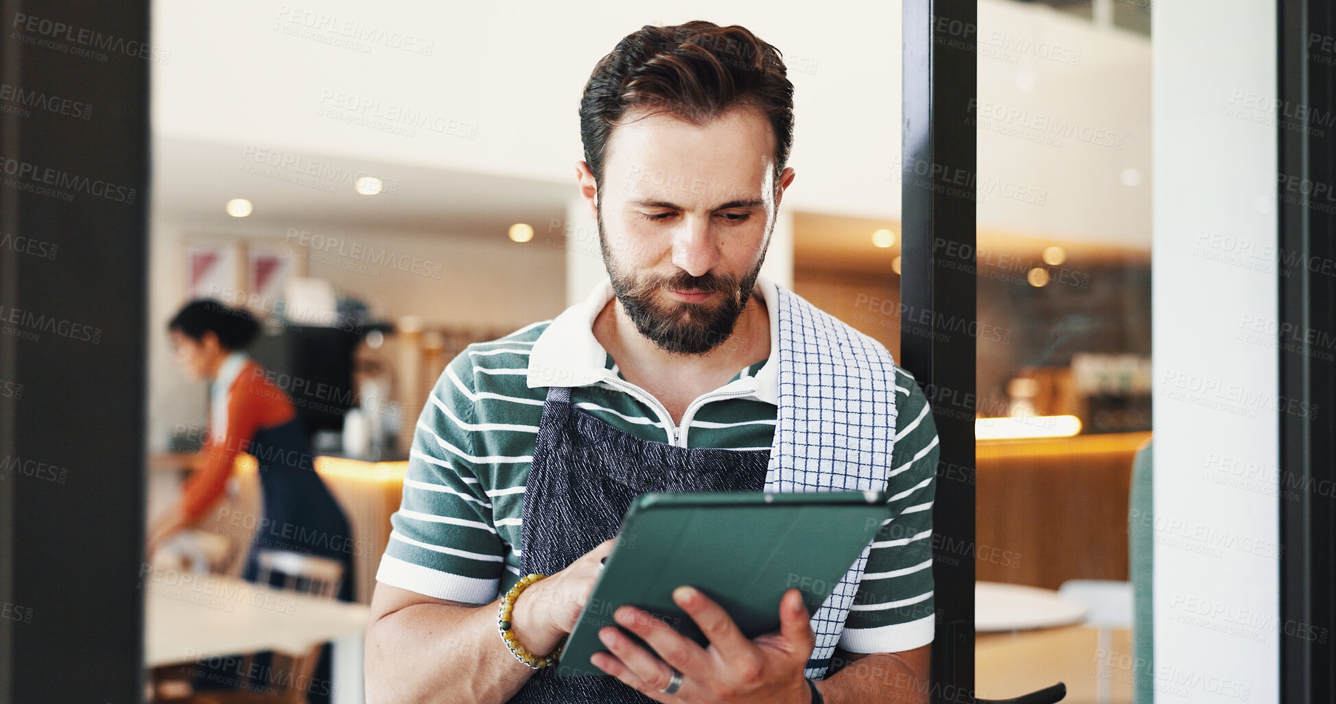 Buy stock photo Employee, internet and man in restaurant tablet and friendly service with app to check inventory. Person, connection and business owner in coffee shop, tech and network with online order and menu