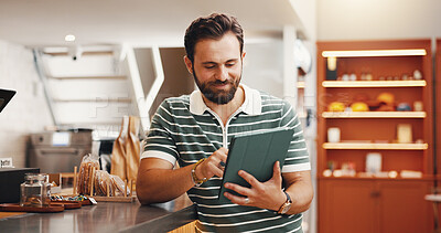 Buy stock photo Employee, internet and man in coffee shop, tablet and connection with online booking. Social media, manager and business owner in cafe, tech and check inventory with digital app for menu and smile