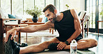 Fitness, exercise and man stretching for legs workout on yoga mat for muscle building in living room. Sports, training and male person with warm up for flexibility with physical activity in home.