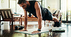 Plank, training and man in home, exercise and balance for core muscles in living room and stretching. Morning, fitness and person with routine in lounge, posture and wellness with workout in house