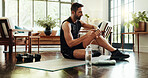 Fitness, home and man with watch for exercise, training and cardio workout on yoga mat. Morning routine, pilates and person check time, heart rate and progress for health, wellness and performance
