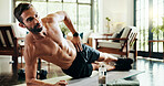 Plank, balance and man in home, exercise and training for core muscles in living room and stretching. Morning, fitness and person with routine in lounge, posture and wellness with workout in house