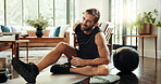Fitness, house and man with back ache, injury or accident for intense workout with mistake. Sports, exercise ball and person with muscle sprain, discomfort or spine pain for training error in home.