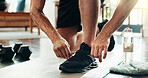 Hands, fitness man and tie shoes to start exercise, sports workout and ready for morning training. Male person, lace sneakers and preparing for weightlifting performance, wellness challenge and house
