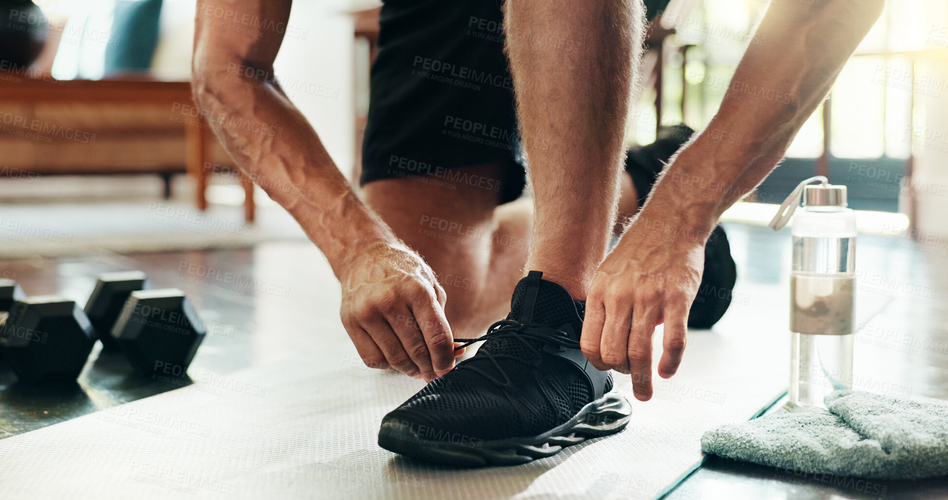 Buy stock photo Hands, fitness man and tie shoes to start exercise, sports workout and ready for morning training. Male person, lace sneakers and preparing for weightlifting performance, wellness challenge and house