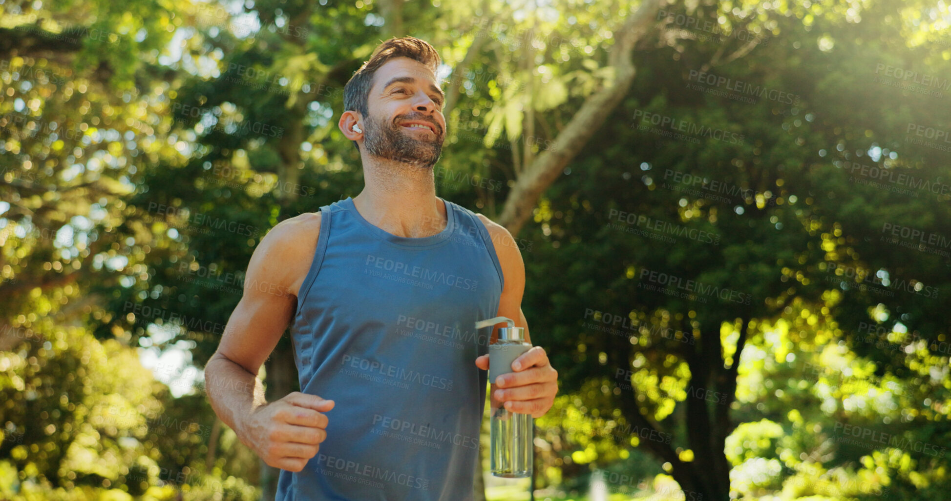 Buy stock photo Smile, athlete man and earphones for running outdoor with cardio exercise, training and marathon goals. Active person, runner and sports workout practice, fitness performance and listening to podcast