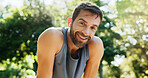 Portrait, active man and relax outdoor for running exercise, training recovery and practice for marathon. Tired, male person and rest with sports workout, fitness performance and listening to podcast