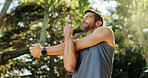 Active, man and stretching as runner outdoor for cardio exercise, endurance training and marathon. Athlete, warm up and fitness ready with sports workout, running performance and listening to podcast