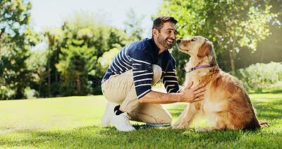 Buy stock photo Smile, dog and relax with man in park for bonding, foster care and animal training. Golden retriever, summer and Happiness with person and pet adoption in nature for canine, support and wellness