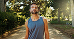 Portrait, active man and fitness outdoor with cardio exercise, endurance training and marathon. Male athlete, confidence and sports workout, running performance and earpods with listening to podcast