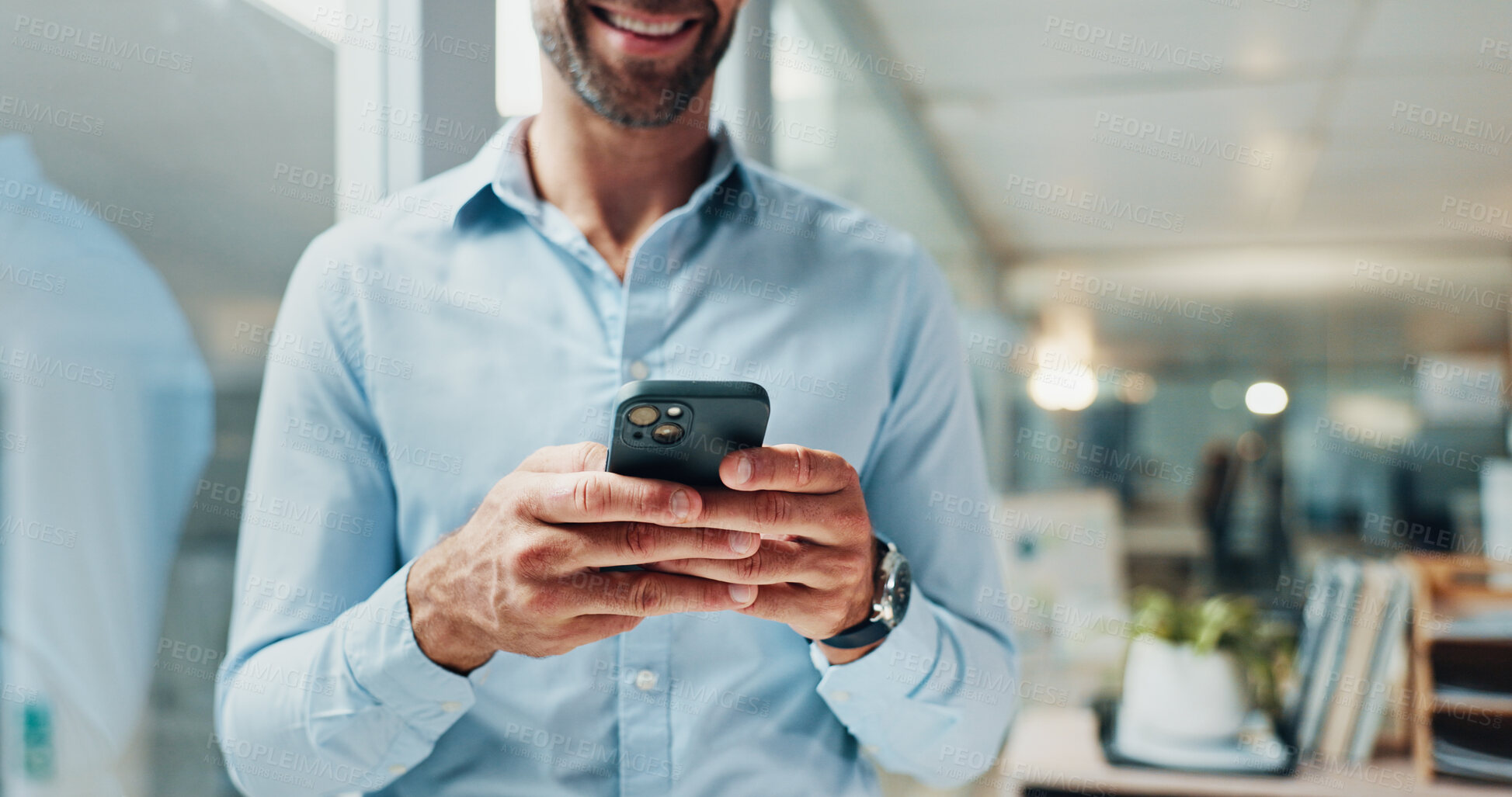 Buy stock photo Hands, phone and texting by glass in office with smile, contact or notification on web at startup. Business man, smartphone and click on mobile app, social media and networking at creative agency