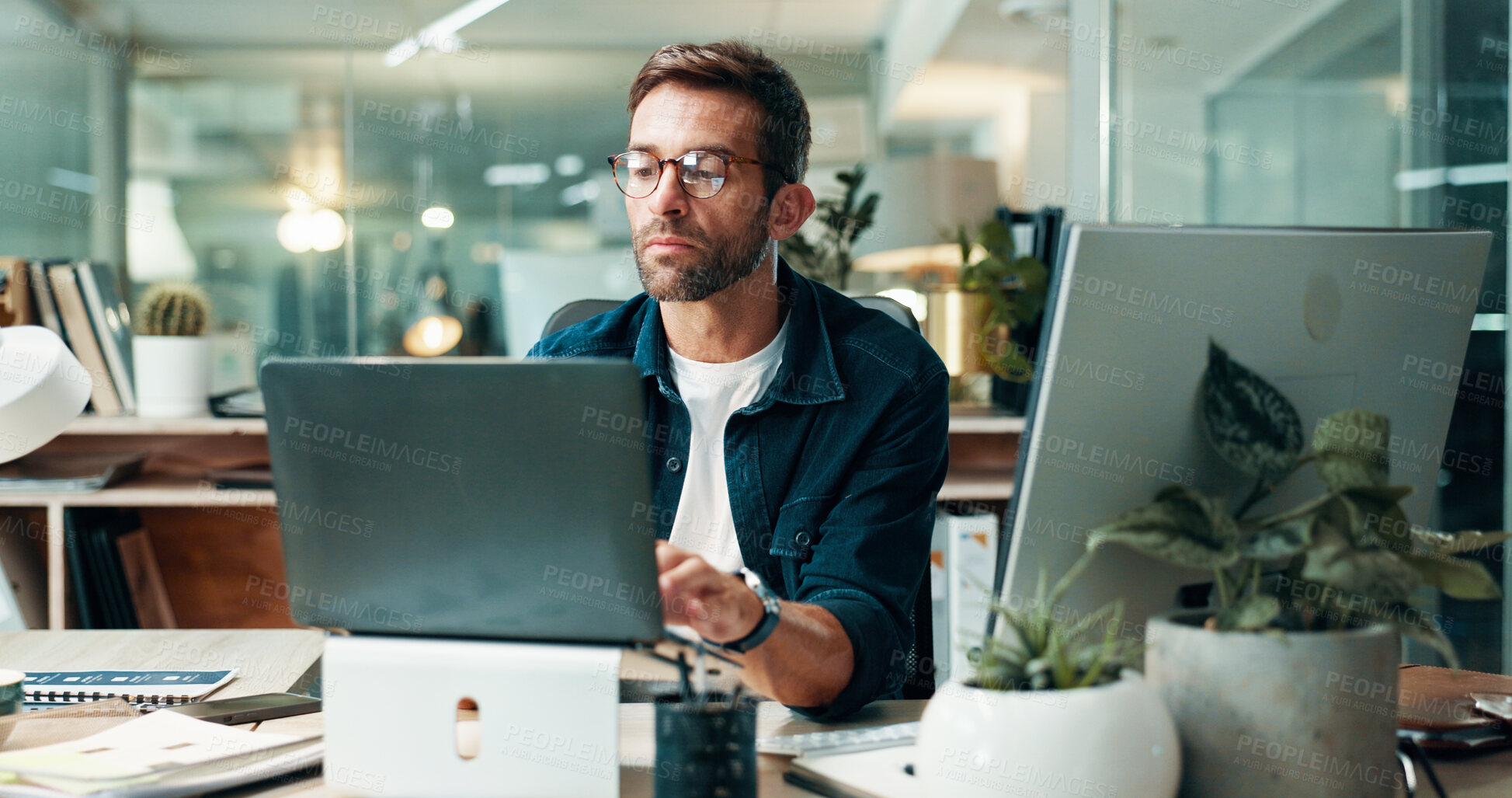 Buy stock photo Businessman, journalist and information with laptop in office, research and news for publication. Deadline, male person and content writer with tech for proofreading, editing story and blog at night