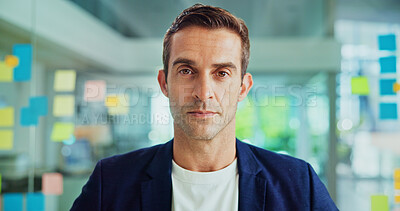Buy stock photo Portrait, serious and business man by glass wall, project management or creative writer. Face, confident worker and entrepreneur, professional and magazine editor with sticky note in startup office