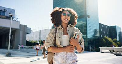 Buy stock photo Happy, student and woman in city walking with books for travel to university, college and school campus. Smile, relax and person with backpack in urban town for education, learning and knowledge