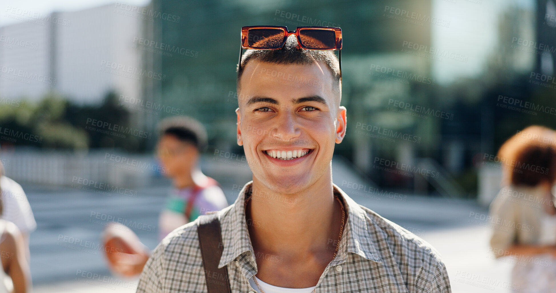 Buy stock photo Happy, student and portrait of man in city with books for travel to university, college and school campus. Smile, relax and person with backpack in urban town for education, learning and knowledge