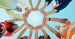 Blue sky, below and hands of people in circle for support, solidarity and community outdoors. Diversity, students and group of friends with fist pump in huddle for school, university and college