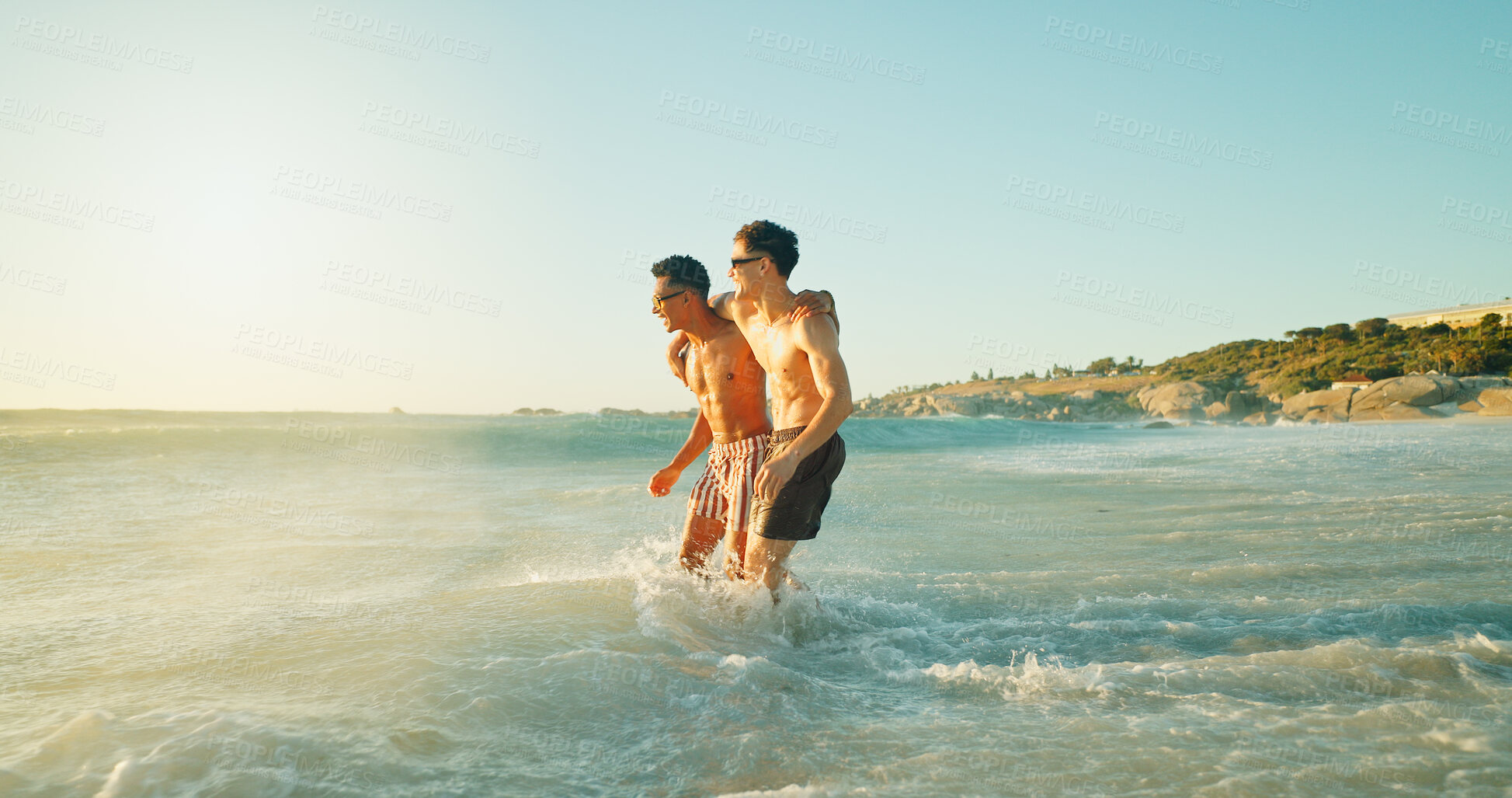 Buy stock photo Beach, holiday and friends in ocean on vacation or adventure together for travel with space. Fun, happy and men swimming in sea water for activity or hobby on tropical weekend trip with freedom.