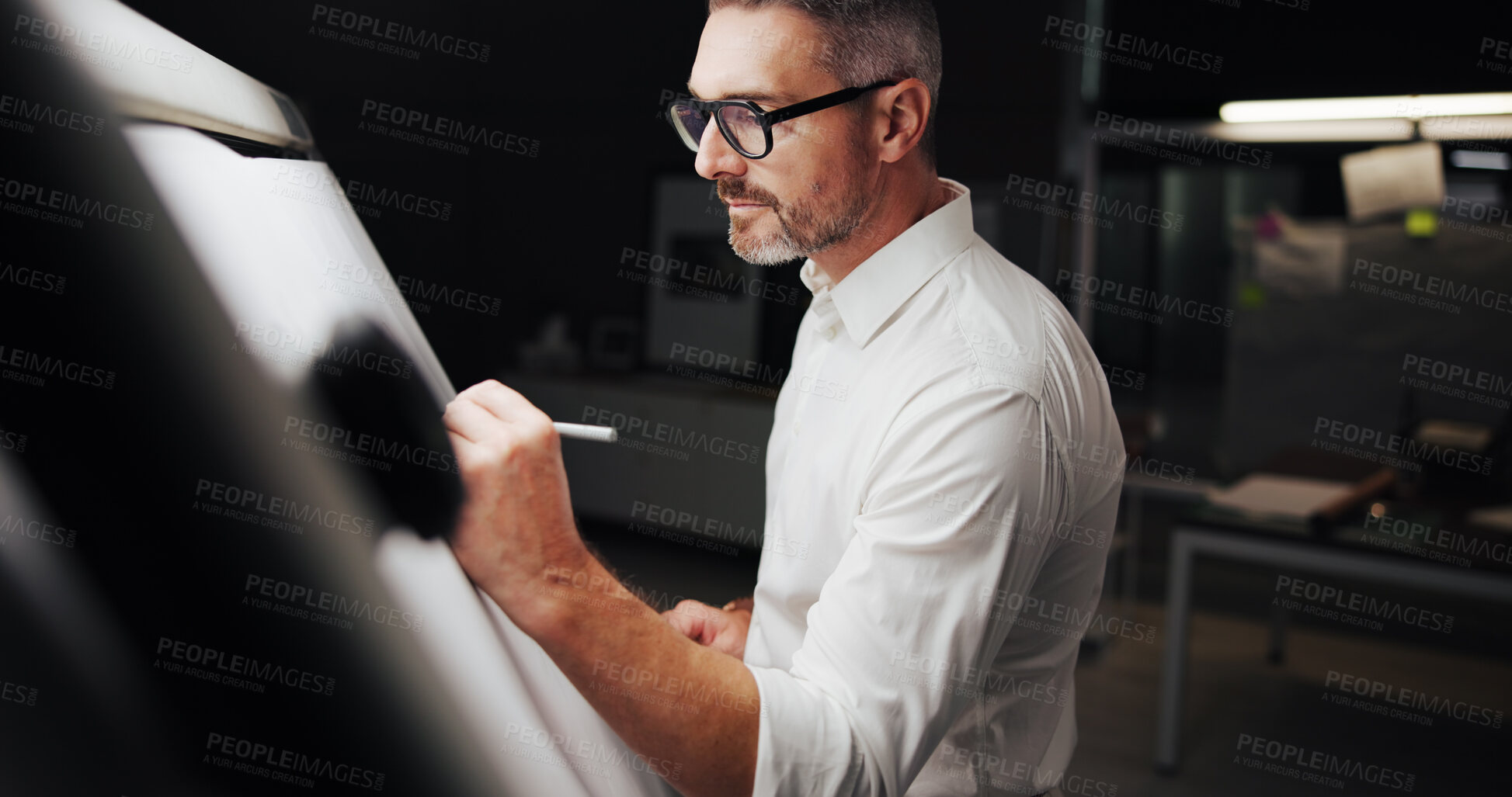 Buy stock photo Drawing, architecture and man with paper for design, property development and building. Creative designer, engineer and deadline with blueprint, floor plan and illustration for structure at night