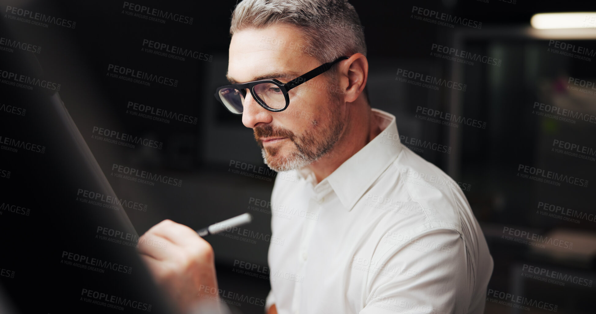 Buy stock photo Drawing, engineer and man with paper at night for design, property development and building. Creative designer, architecture and worker with blueprint, floor plan and sketching for structure in dark