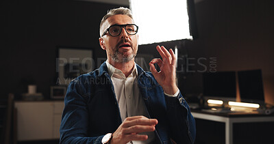 Buy stock photo Mature man, discussion or interview with talk for online tutorial or development process. Male person, influencer or presentation with recording or documentary for helpful tips, night lesson or guide