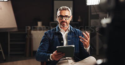 Buy stock photo Mature man, discussion or online interview with tablet for tutorial or development process. Male person, influencer or presentation with recording for creative documentary, help tips or night lesson