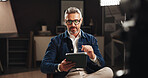 Talk show host, recording and man with tablet in home studio for news update, podcast episode or live chat. Filming set, mature journalist and digital script for online broadcast and content creation