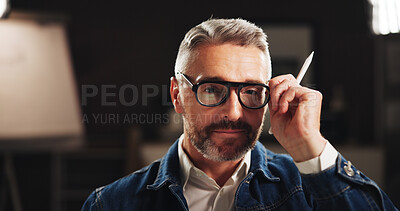 Buy stock photo Mature man, portrait and night with glasses for creative production or development in art studio. Male person, artist or professional graphic designer working late in POV for digital content creation