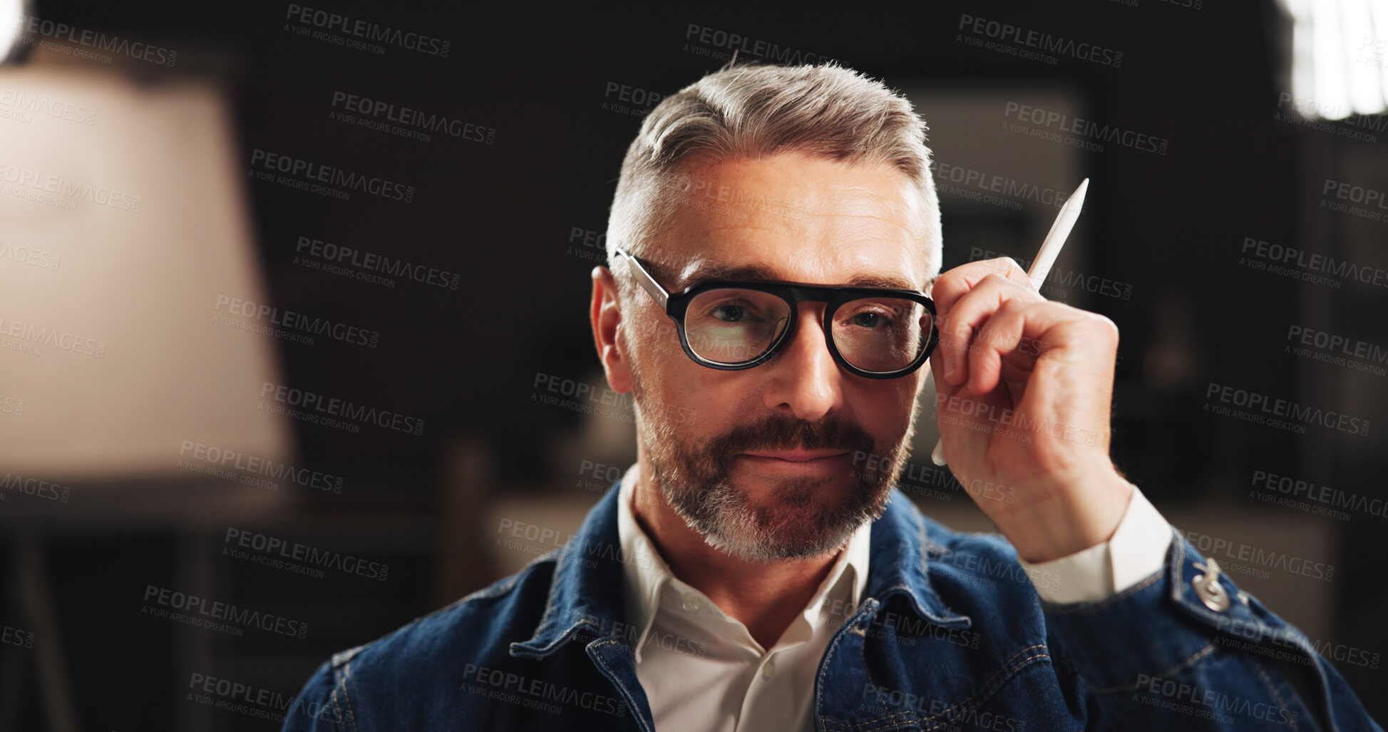 Buy stock photo Mature man, portrait and night with glasses for creative production or development in art studio. Male person, artist or professional graphic designer working late for digital content creation