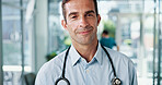 Doctor, man and portrait with stethoscope at clinic for healthcare support, about us and career confidence. Medicine professional, physician and space for medical treatment, hospital care and pride