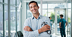 Doctor, man and arms crossed with stethoscope at hospital for medical service, about us and healthcare worker. Medicine portrait, physician and confidence for health treatment, pride and clinic care