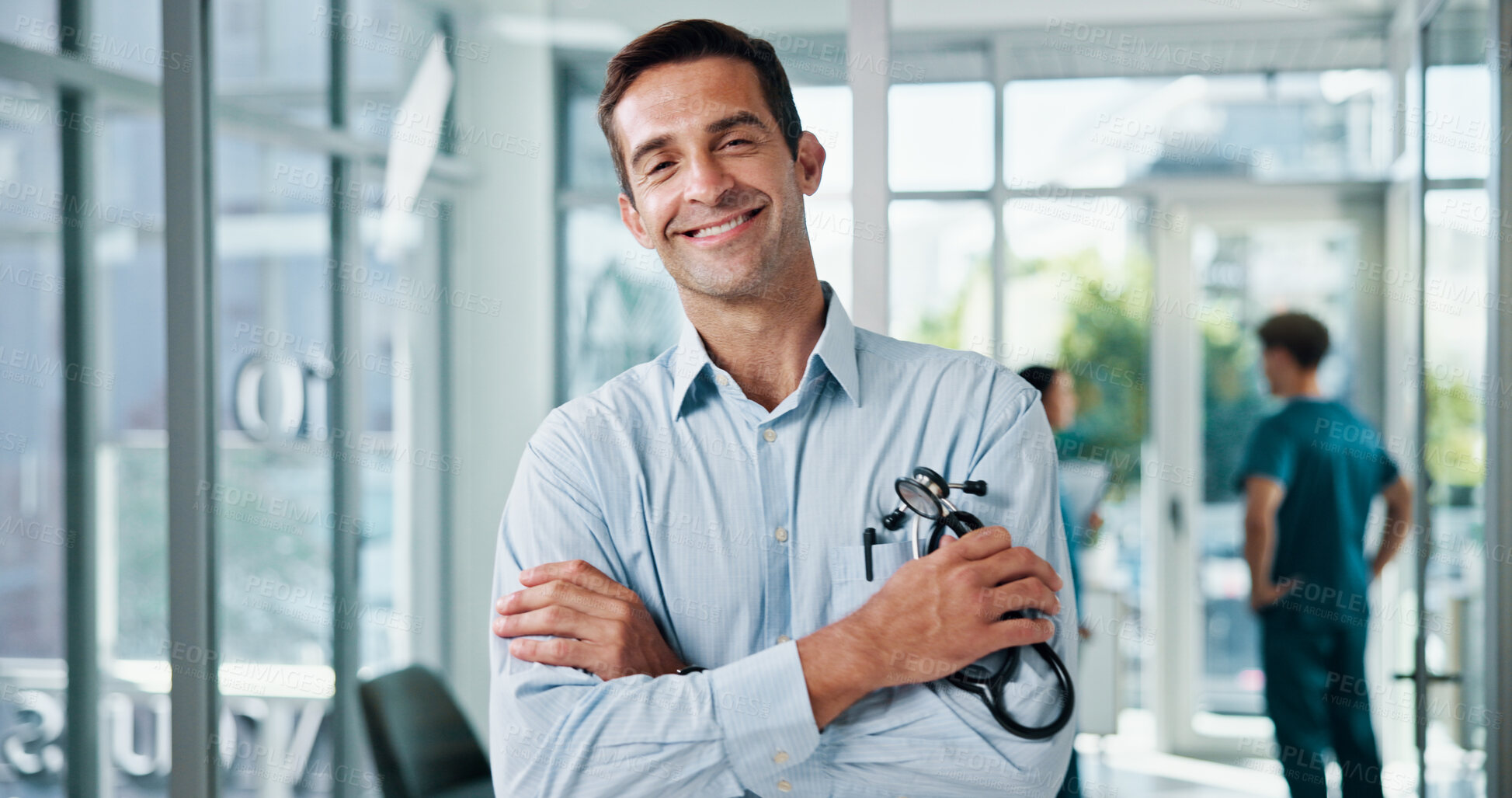 Buy stock photo Doctor, man and arms crossed with stethoscope at hospital for medical service, about us and healthcare worker. Medicine portrait, physician and confidence for health treatment, pride and clinic care