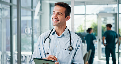 Buy stock photo Happy man, doctor and thinking with tablet for medical improvement, positive results or research at hospital. Male person, surgeon or healthcare professional with smile on technology for new study