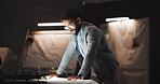 Businessman, architect and reading with blueprint for construction planning or building design. Man, civil engineer or working late with paper, notes or draft at night for project deadline or layout