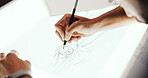 Person, hands and designer with drawing for car prototype, modeling or graphic design on light table. Closeup, mechnical engineer or digital sketch with 2D vehicle, blueprint or automobile project