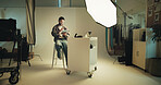 Photoshoot, studio and photographer with tablet on set for creative, branding and career. Media, production and happy person with photography behind the scenes for fashion magazine cover with agency