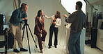 Discussion, getting ready and photography with people in studio together for photoshoot or planning. Backstage, creative or media with happy model, makeup artist and photographer talking on set