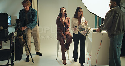 Buy stock photo Photography, portrait and smile of model in studio together for filming, photoshoot or planning. Behind the scenes, creative people or media with makeup artist and photographer getting ready on set