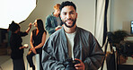 Camera, portrait and smile with photographer man in studio for photoshoot planning or review. Backstage, happy or photography with make up artist and model getting ready for media filming on set