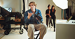 Camera, photography and talking with director man in studio for discussion, photoshoot or planning. Backstage, creative or media with makeup artist, model and photographer on set for film directing