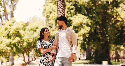 Buy stock photo Walking, holding hands and couple with smile, park and romance for people in nature, love and anniversary. Outdoor, woman and affection for man, happy and together for valentines day or commitment