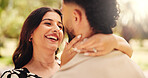 Hug, romance and couple on date, outdoor and love for people in nature, laughing and smile on anniversary. Park, woman and affection for man, happy and together for valentines day, care or commitment