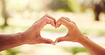 Heart, hands and couple with love in nature for relationship support, marriage commitment and loyalty. Care, people and romantic emoji at park for anniversary date, bonding together and connection