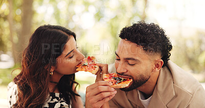 Buy stock photo Couple, picnic and eating pizza outdoor together for romantic date, lunch and bonding for relationship. Man, woman and share fast food at park, hungry or enjoy takeaway to relax with partner for love