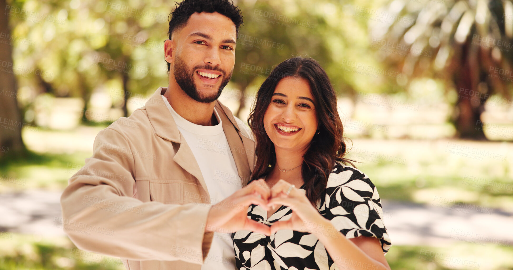 Buy stock photo Portrait, happy and couple with heart shape, park and romance for people with smile, love and together. Outdoor, man and affection for woman in nature, gesture and commitment for relationship or date