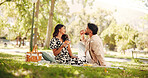 Smile, picnic and couple eating pizza at park for romantic date, lunch and bonding for relationship. Man, woman and share fast food outdoor, hungry and enjoy takeaway to relax with partner for love